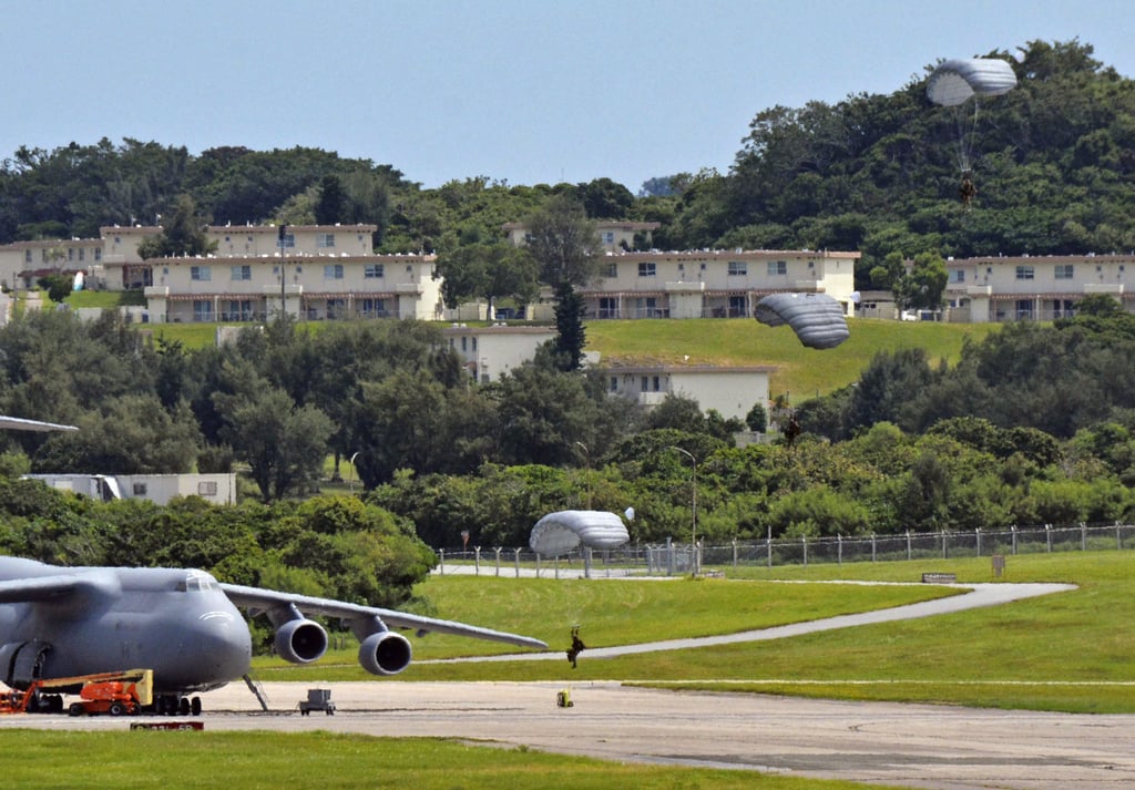 US Air Force personnel hold a parachuting drill at Kadena airbase in Okinawa on September 3. Photo: Kyodo
