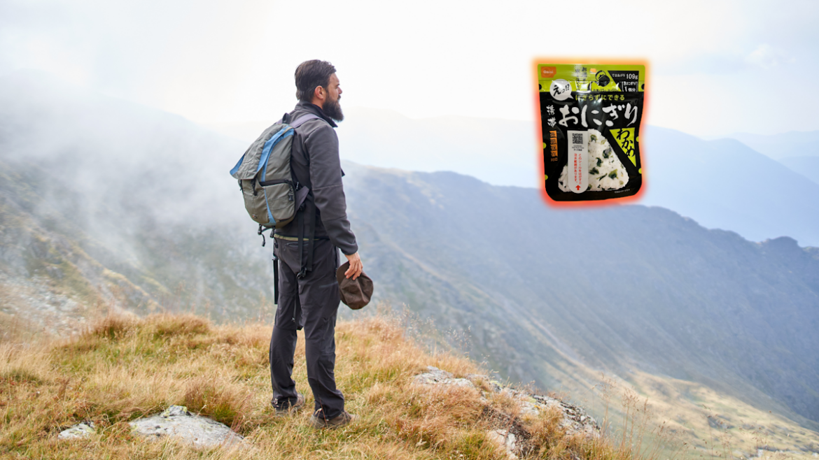 We Tried These Travel Onigiri That Keep For Five Years Hiker standing on cliff and looking at Onisi Onigiri