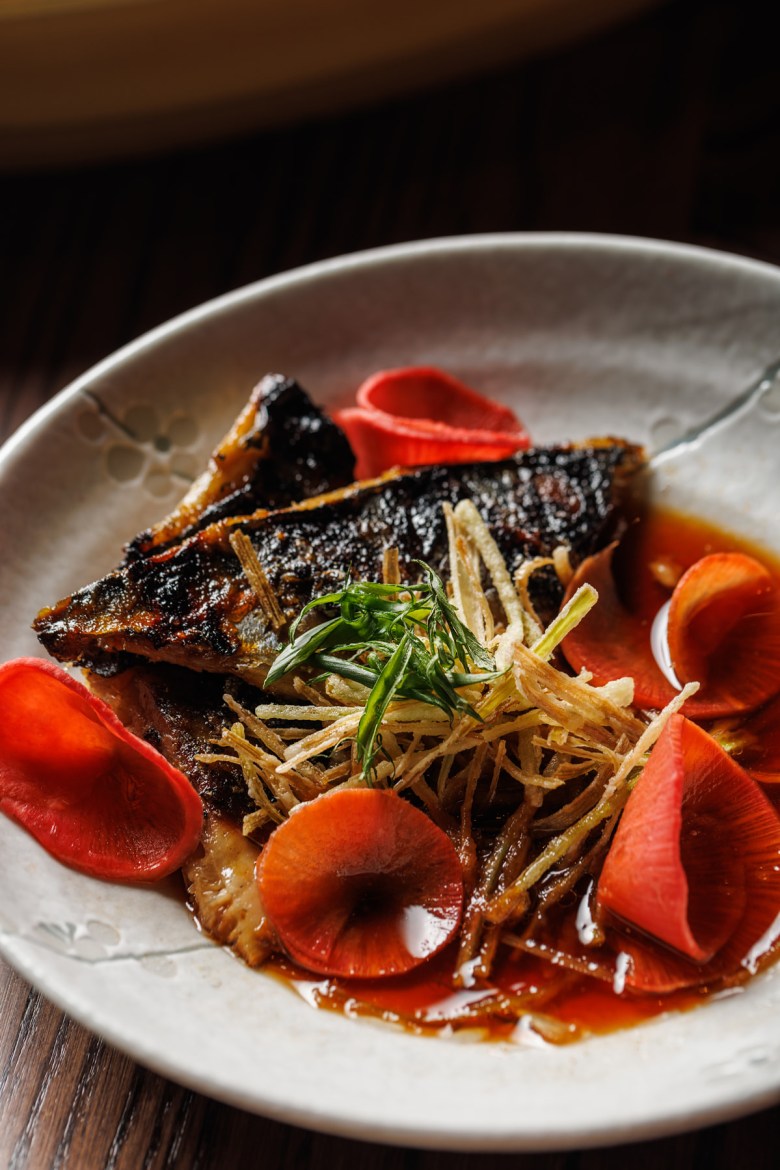 A common home-cooked dish in Japan, Mt. Fuji takes miso saba (marinated grilled mackerel) to new heights with the addition of ponzu, pickled watermelon radish, crispy leeks and house chili oil.