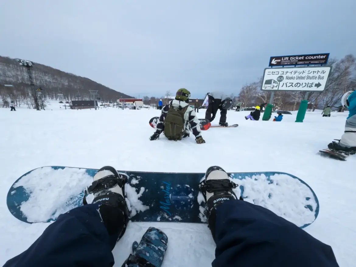 Winter Travel Faces Uncertainty as Japan Issues First Megaquake Alert Since 2022 Snowboarders resting at Hanazono ski area in Niseko, Hokkaido, Japan