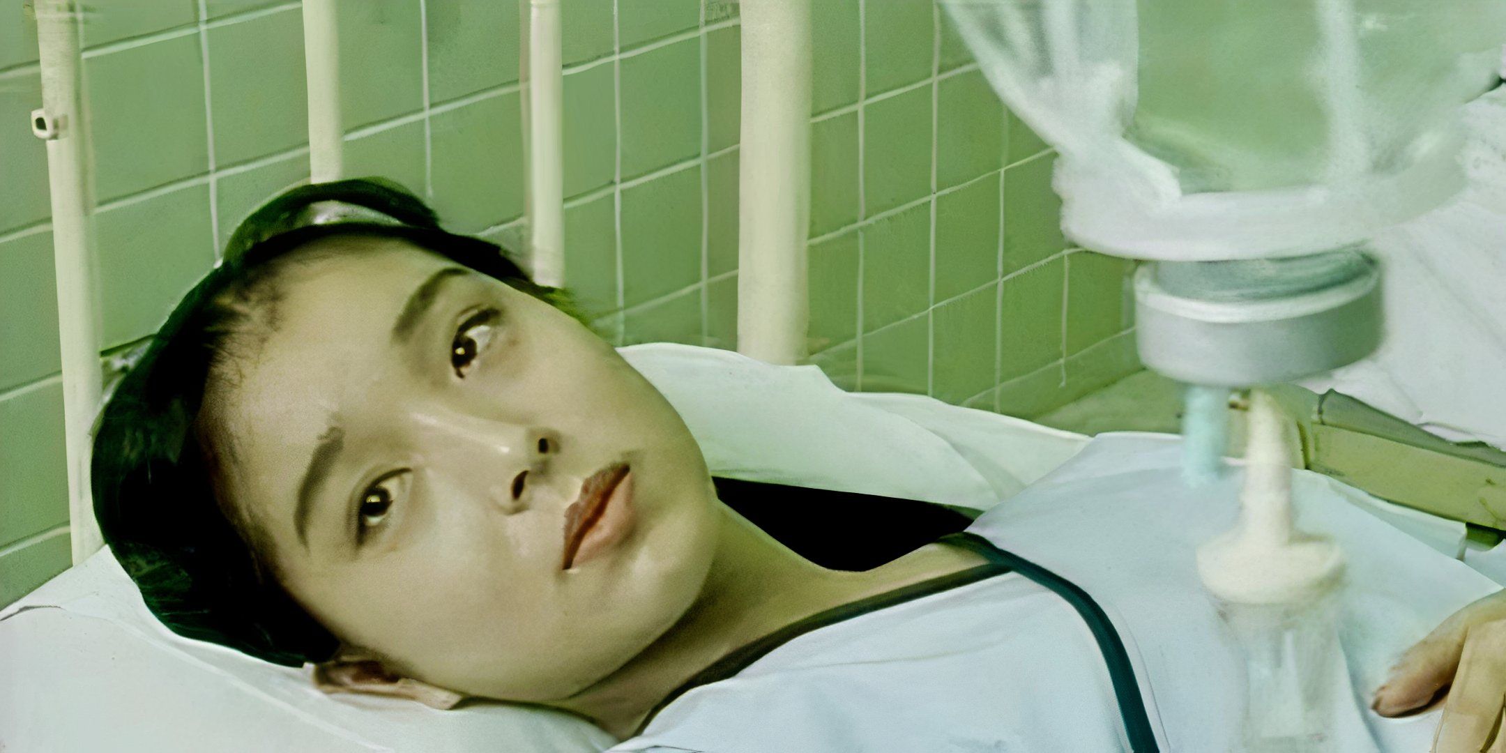 Misa Aika lies in a hospital bed. 
