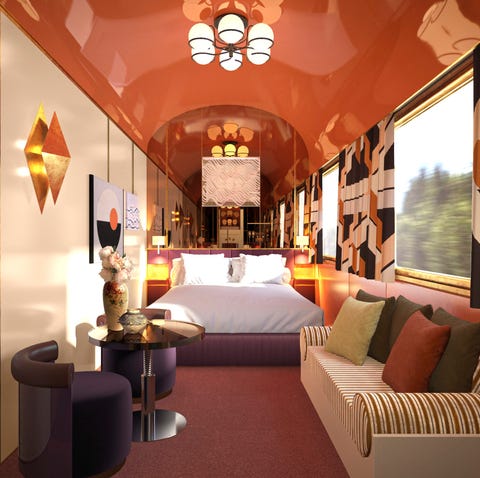 luxurious train cabin interior featuring a bed seating area and decorative elements