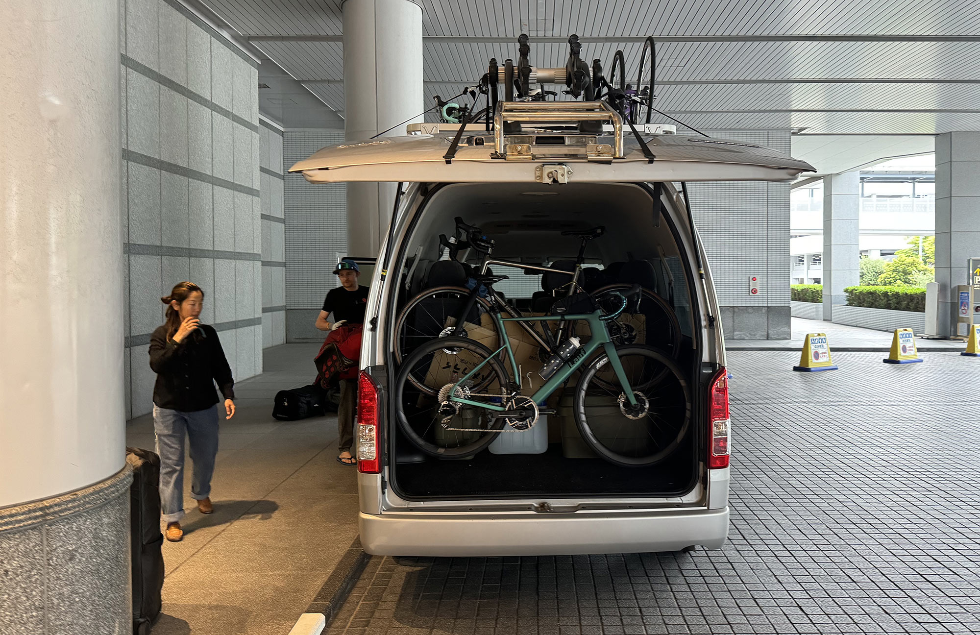 cycle japan ride and seek cycling tour van and guides loading bikes.