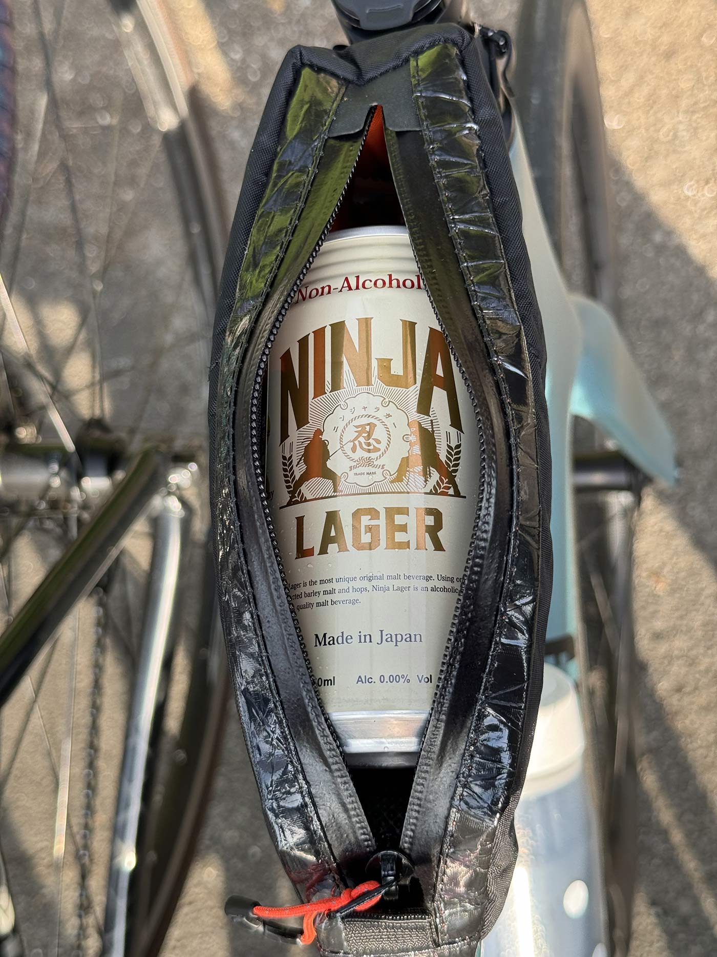 ninja lager non-alcoholic beer in a bicycle top tube bag.