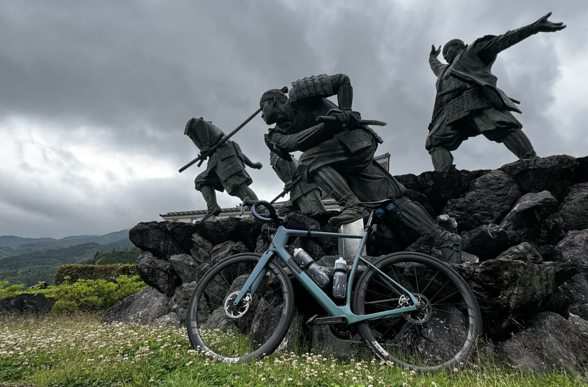 Review: Ride & Seek Samurai Cycling Tour Delivers a Quieter Side of Japan lauf road bike next to samurai statues in japan.