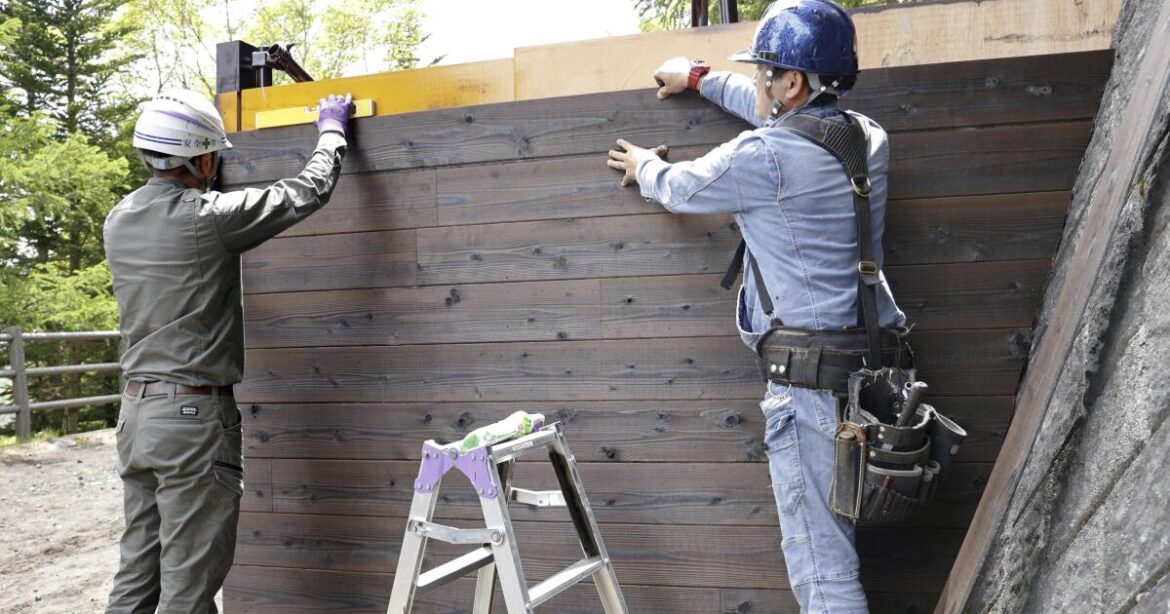 Gate installed on a Mount Fuji trail to control crowds Gate installed on a Mount Fuji trail to control crowds