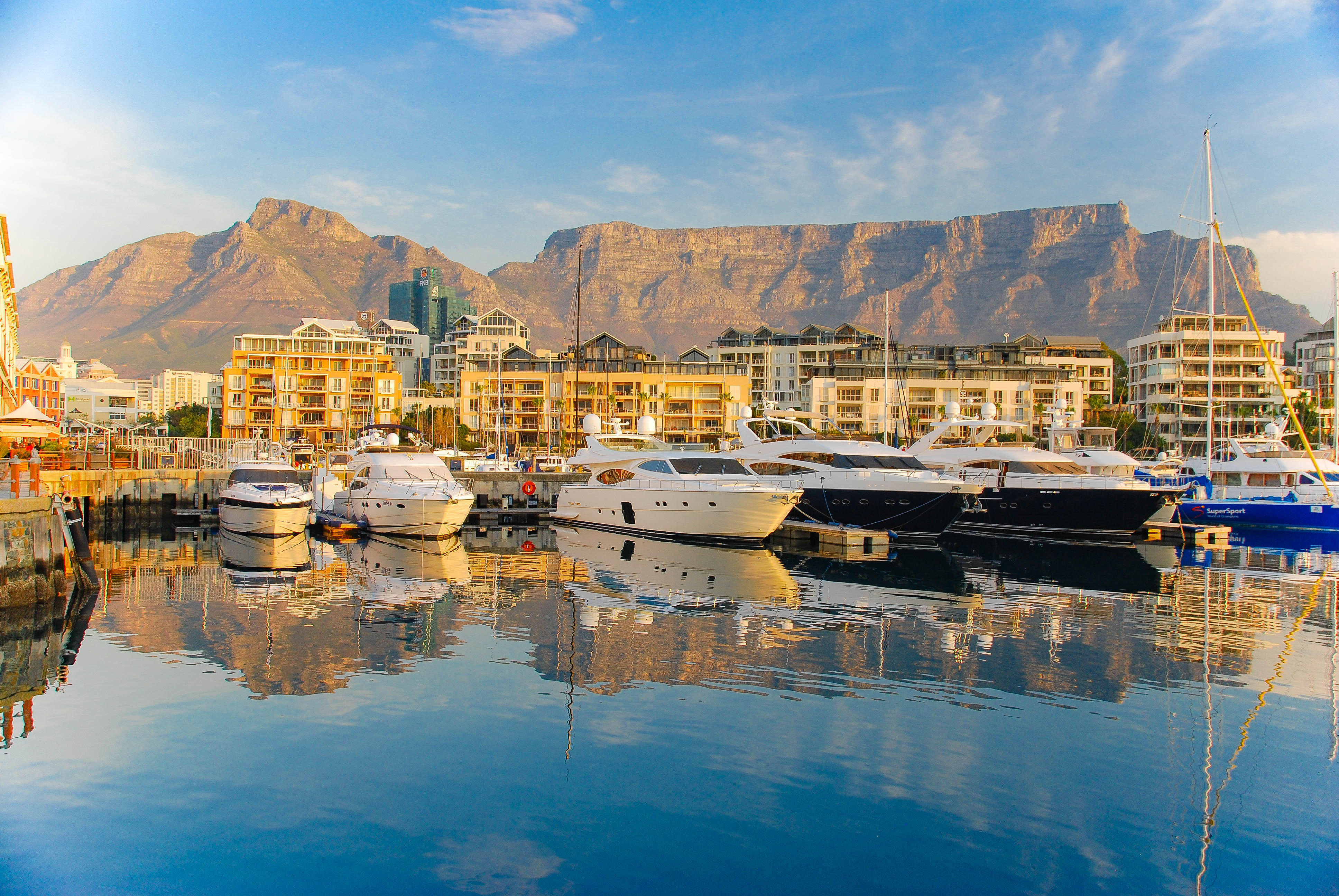 Yachts at the V&A Waterfront in Cape Town with Table Mountain in the background.