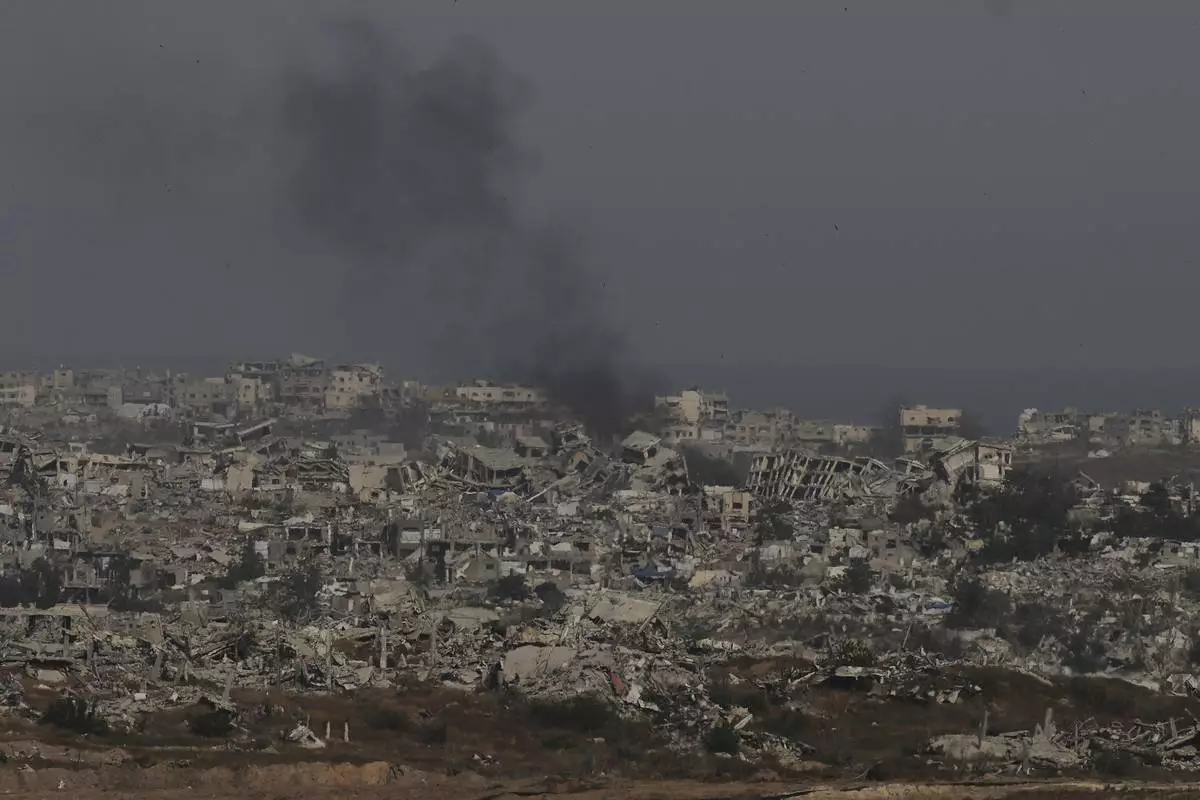 Smoke rises to the sky in the Gaza Strip as seen from southern Israel, Wednesday, April 30, 2025. (AP Photo/Ohad Zwigenberg)