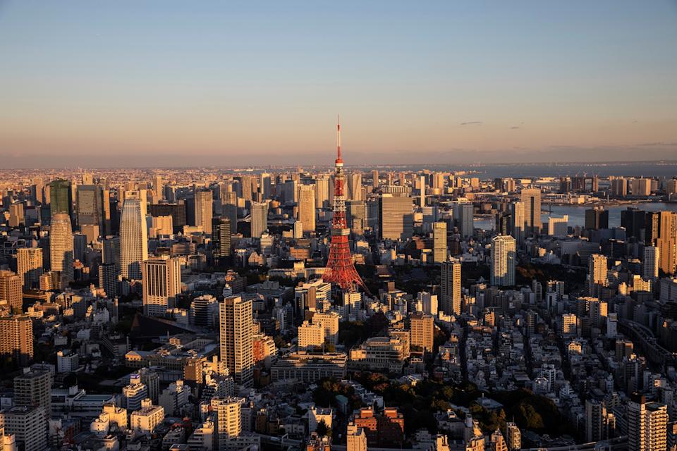 View of Tokyo and Mount Fuji at sunset seen from the top of the Moro Tower building in Tokyo.