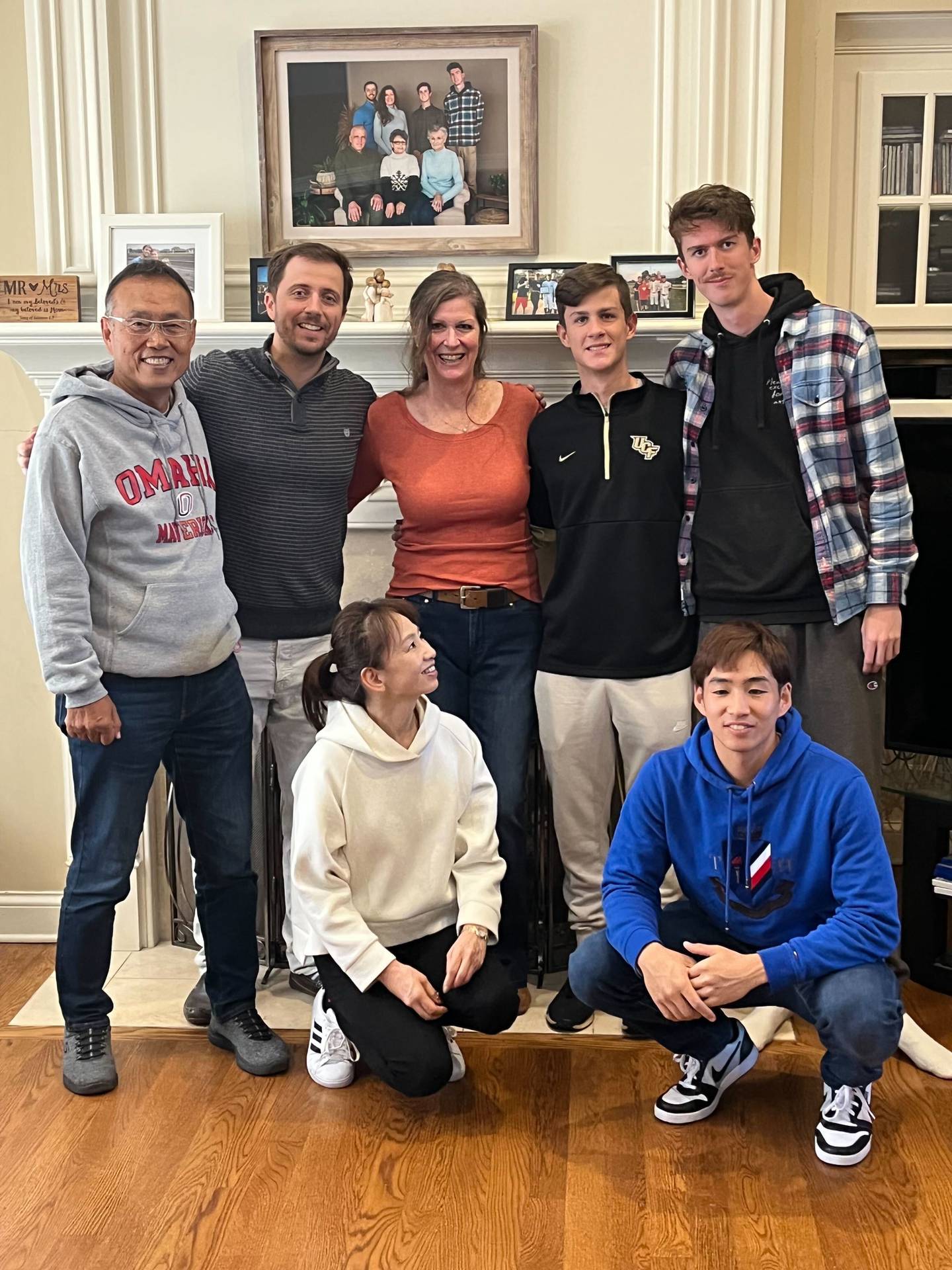Back row from left, Toshiyuki Tomita, Stephen Spiewak, Stacie Spiewak, Ethan Bass and Matthew Bass, front row Masako Tomita and Kengo Tomita pose for a photo in the Spiewak's Lakewood home. Photo provided by Stacie Spiewak