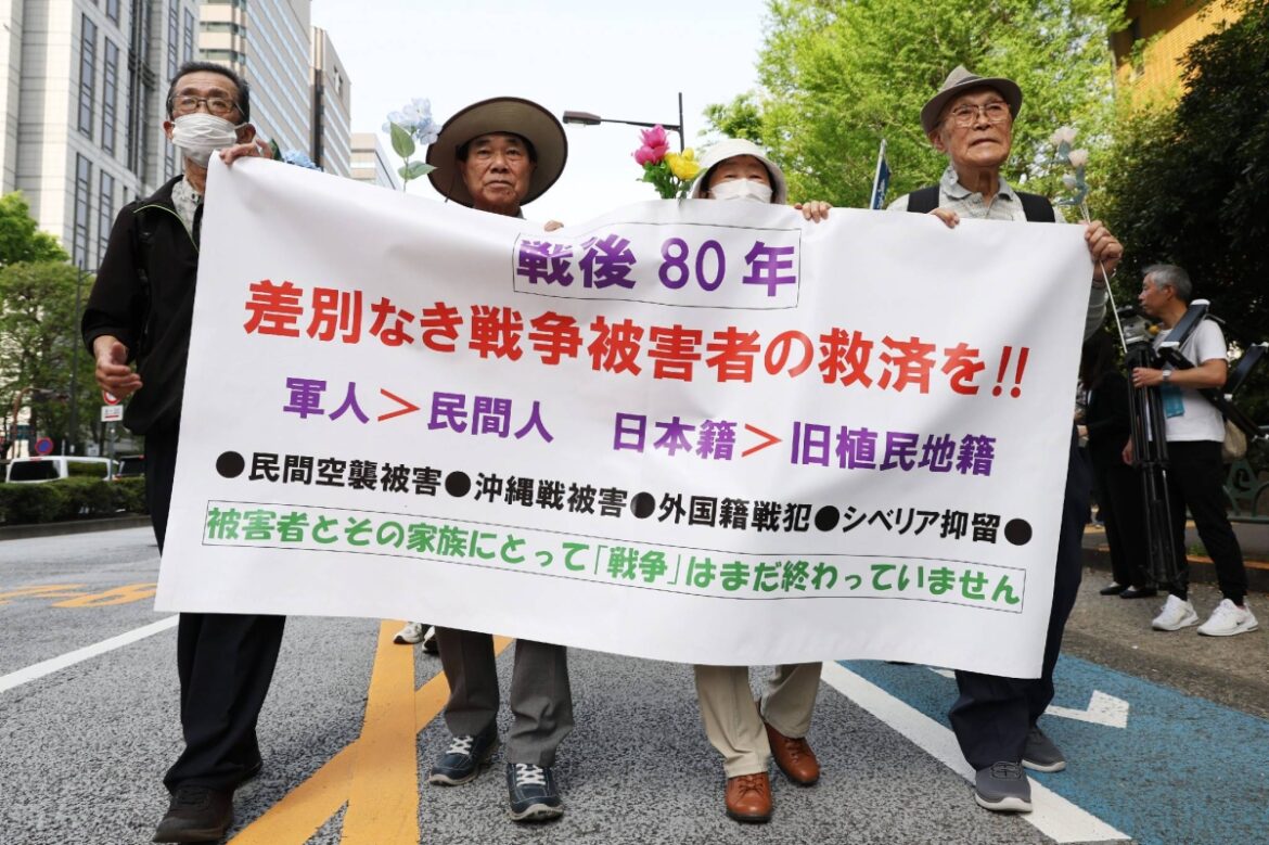 Protesters march for WWII relief for civilians and others who were overlooked