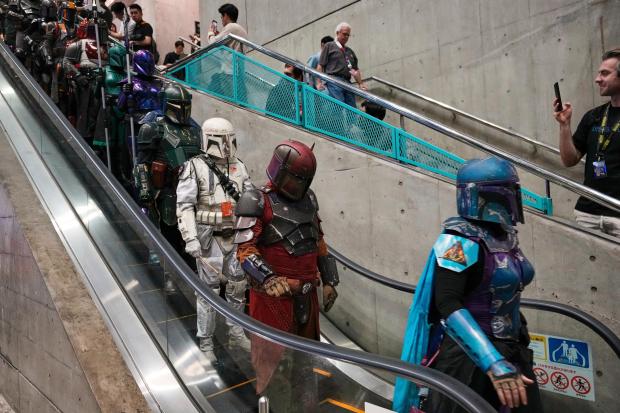Star Wars fans in different creations of the Boba Fett...
