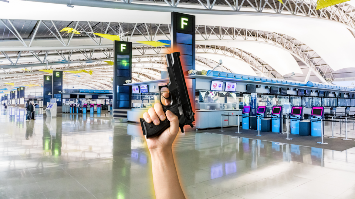 Picture of hand holding a gun (from the bottom of the picture towards the top) with Kansai International Airport as the backdrop