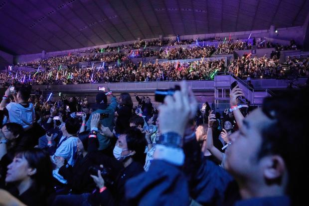Fans react to the opening act during the Star Wars...