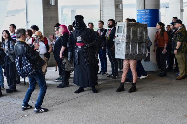 People line up to enter the Makuhari Messe convention center...