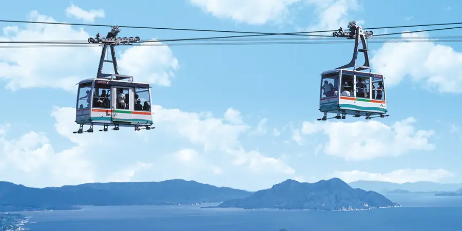 Tourists riding the zipline across Mt. Misen in Miyajima Island