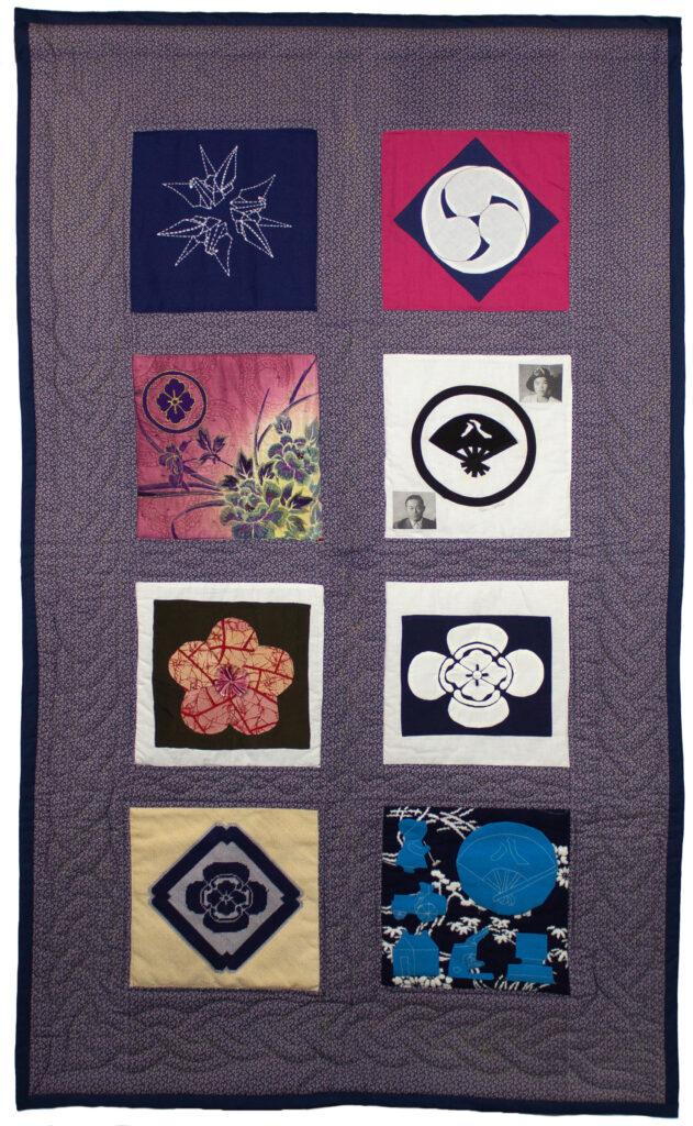 A close up of a multi part quilt made of fabric