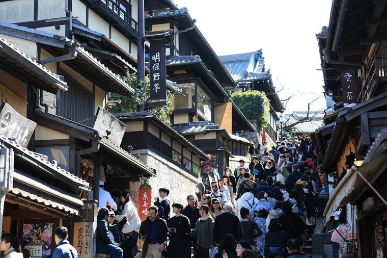 Tourists in the streets around Fushimi Inari Shrine in Kyoto (Photo: Aytug Can Sencar/Anadolu via Getty Images)