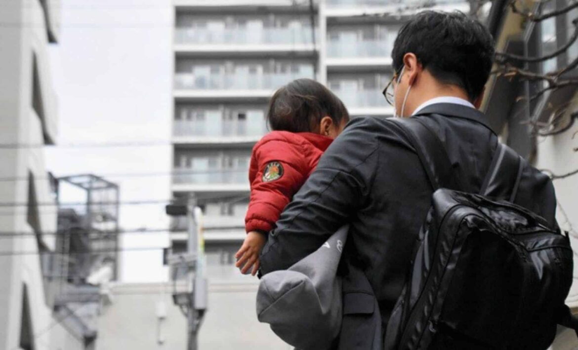 Tokyo Turns to 4-Day Workweek in a Desperate Bid to Free Japan from Its ‘Oldest Population’ Title A Man Holding His Kid