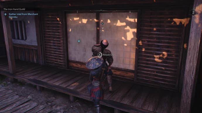 Naoe grabbing the Iron Hand Guild merchant, Ginroku, in Assassin's Creed Shadows.