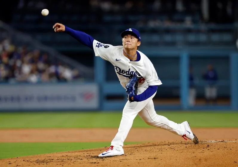 LOS ANGELES, CA - APRIL 11: Los Angeles Dodgers pitcher Yoshinobu Yamamoto throws.