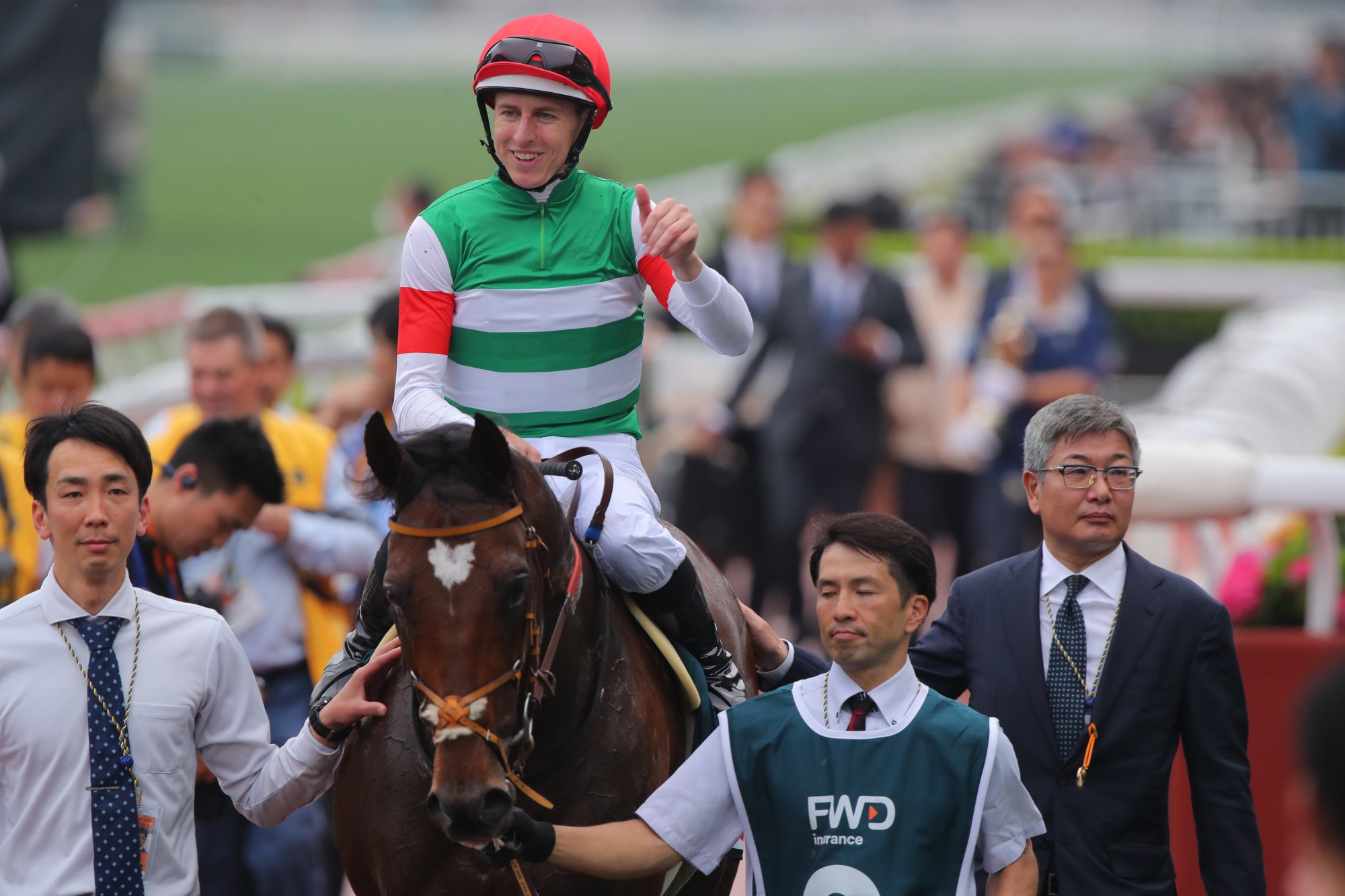 Damian Lane gives the thumbs up as he is led back in Tastiera.