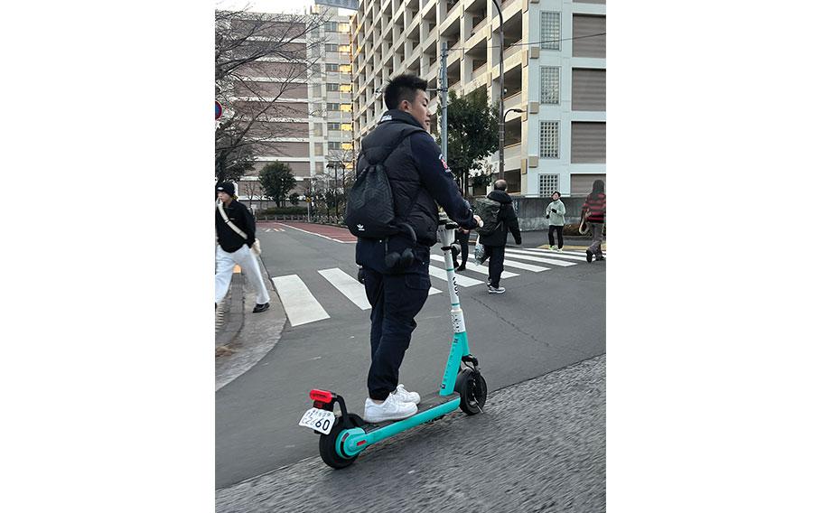 a man riding an e-scooter