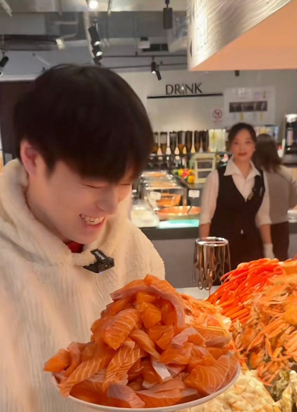 Deng Chenen eyes up a massive plate of food he took from a restaurant buffet. Photo: Douyin