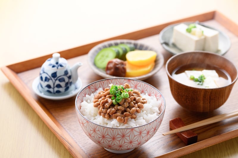 Washoku - natto on rice with miso, tofu, and other dishes.