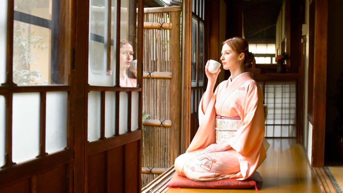 Kyoto Ryokans Stop Serving Traditional Japanese Food That Foreign Tourists Hate Woman drinking tea inside of an old traditional Japanese house/ryokan