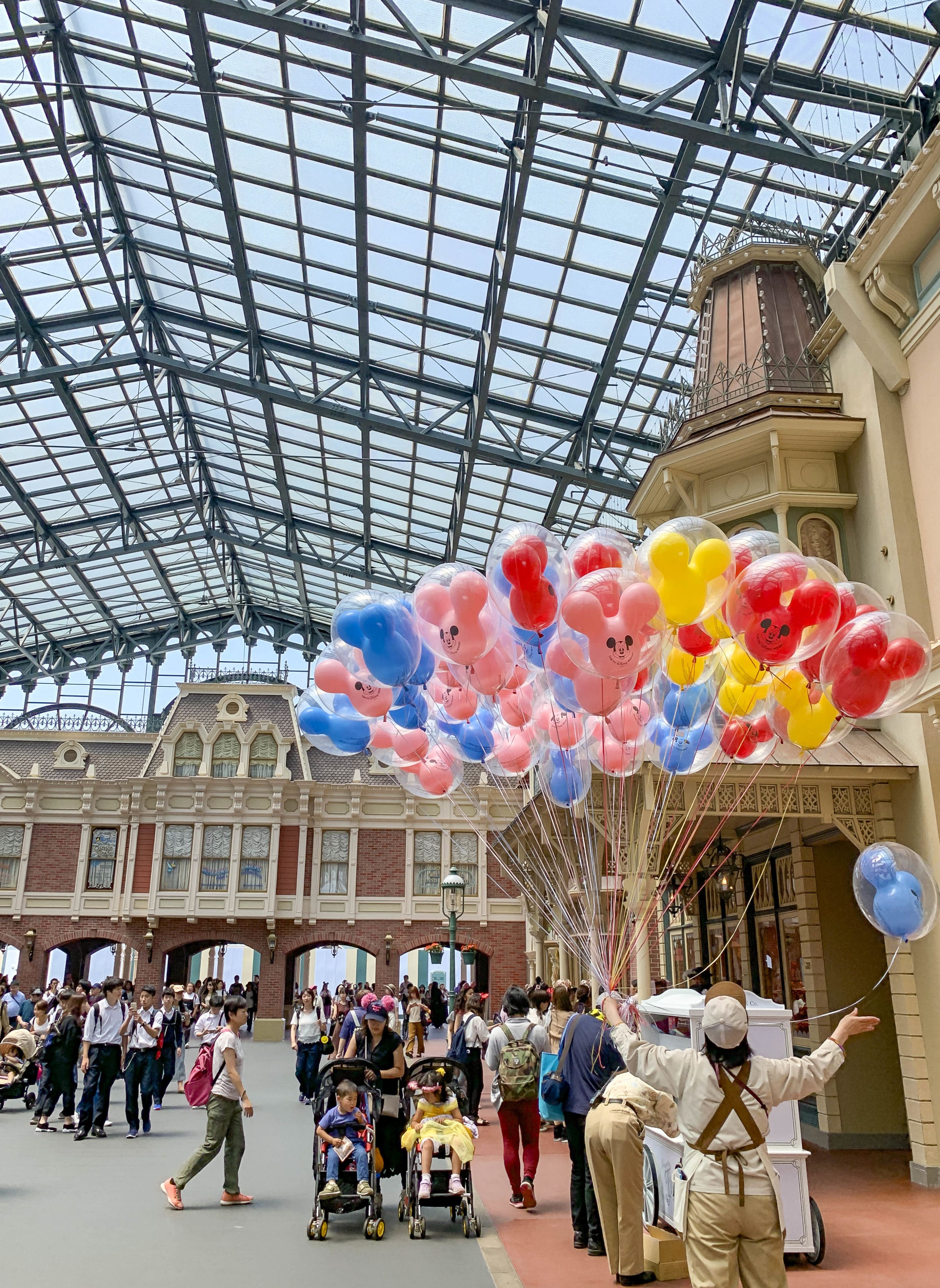 Mickey Mouse balloons for sale at the World Bazaar entrance to Tokyo Disneyland, one of the top things to do in Tokyo with kids.