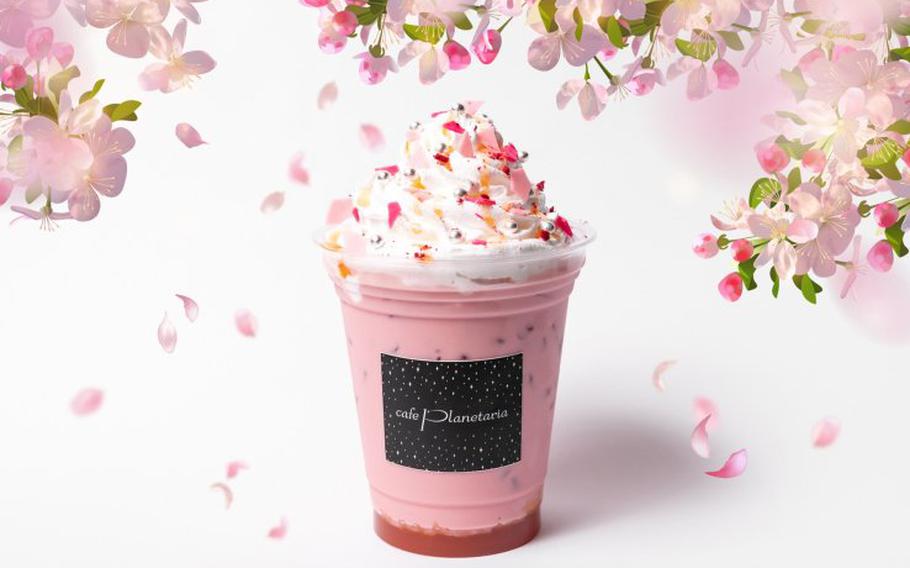 Sakura Peach Latte. whipped cream is on the top of it.