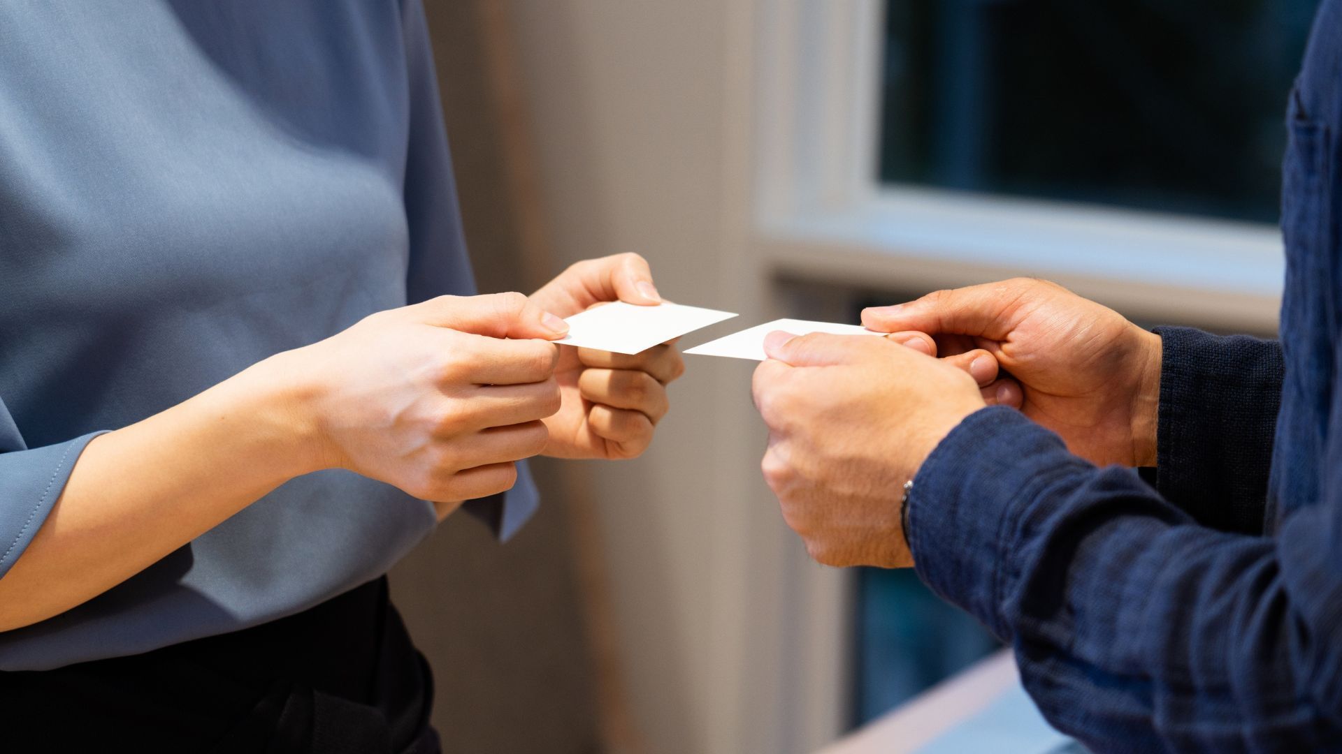 People exchanging business cards 
