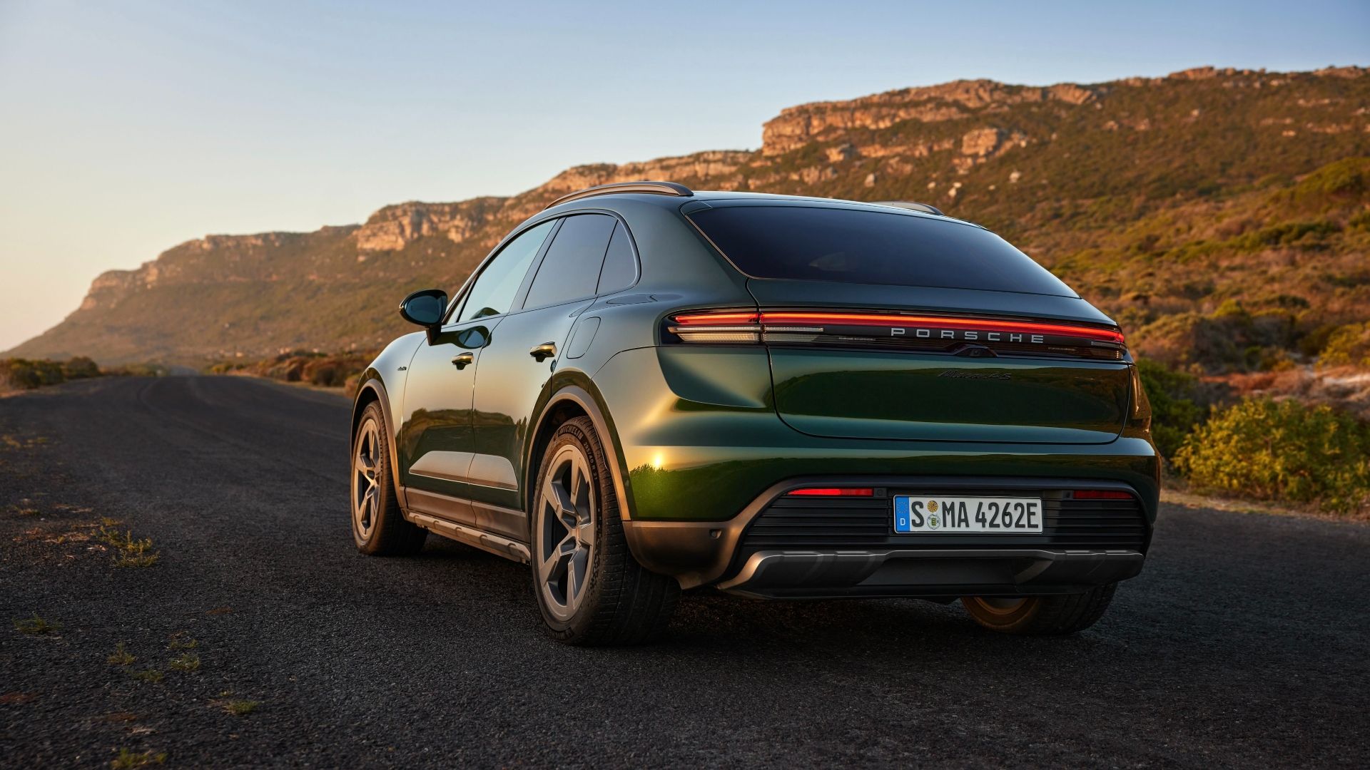 Rear three-quarters shot of a Porsche Macan Electric