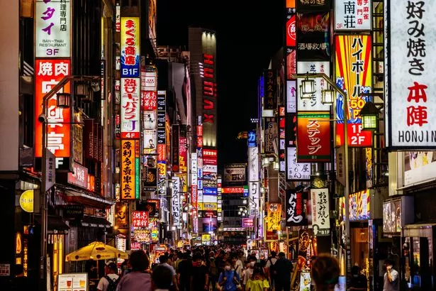 A bustling night in downtown Tokyo, a popular tourist destination