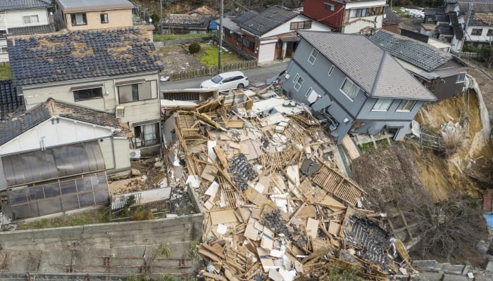 An aerial photo shows damaged and destroyed homes along a street in Wajima, Ishikawa prefecture on January 2, 2024. —AFP