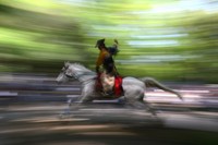 A mounted archer speeds along the course at Shimogamo Shrine in Kyoto's Sakyo Ward during the 