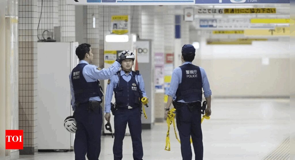 Man with knife slashes two at a Tokyo station Man with knife slashes two at a Tokyo station