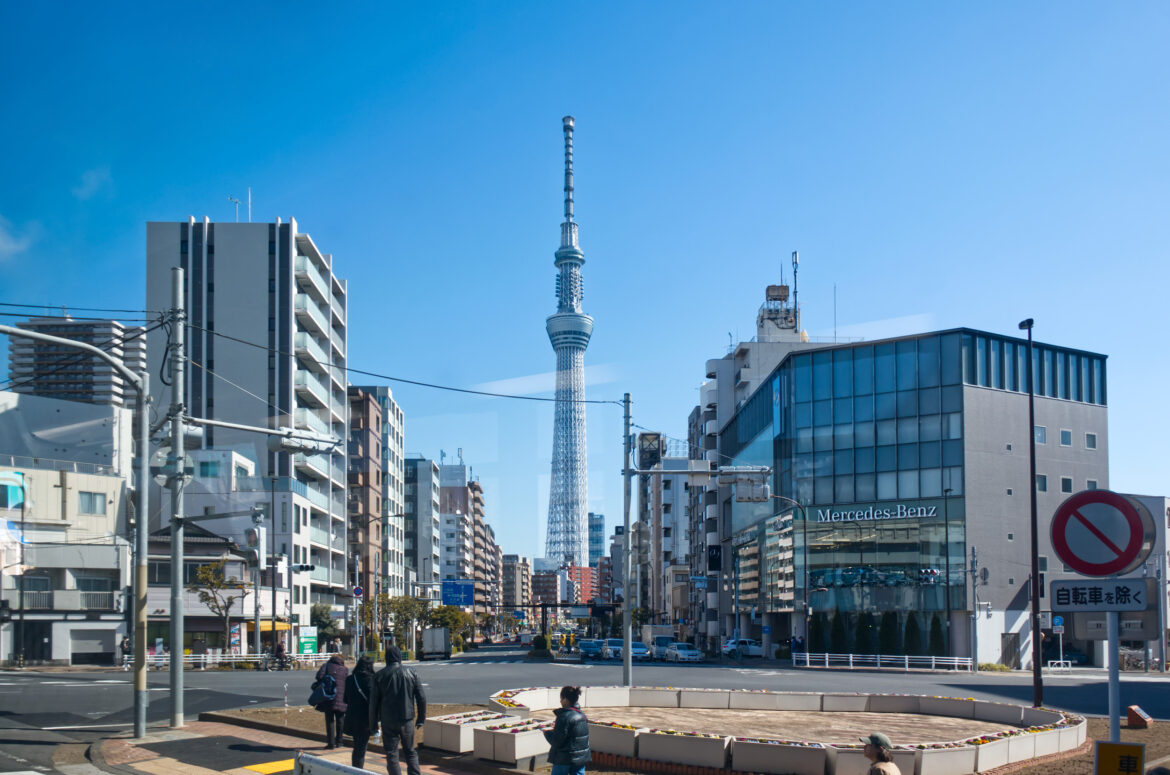 Buildings in Tokyo, Tokyo Skytree in backdrop.