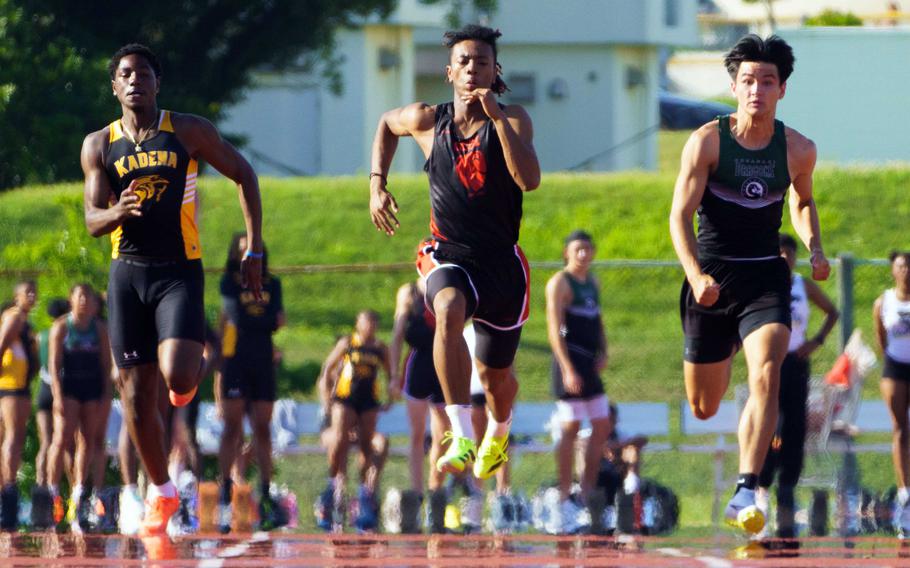 OCSI’s Jeremiah Tucker, center, now holds the Pacific record in the 100 at 10.45 seconds.