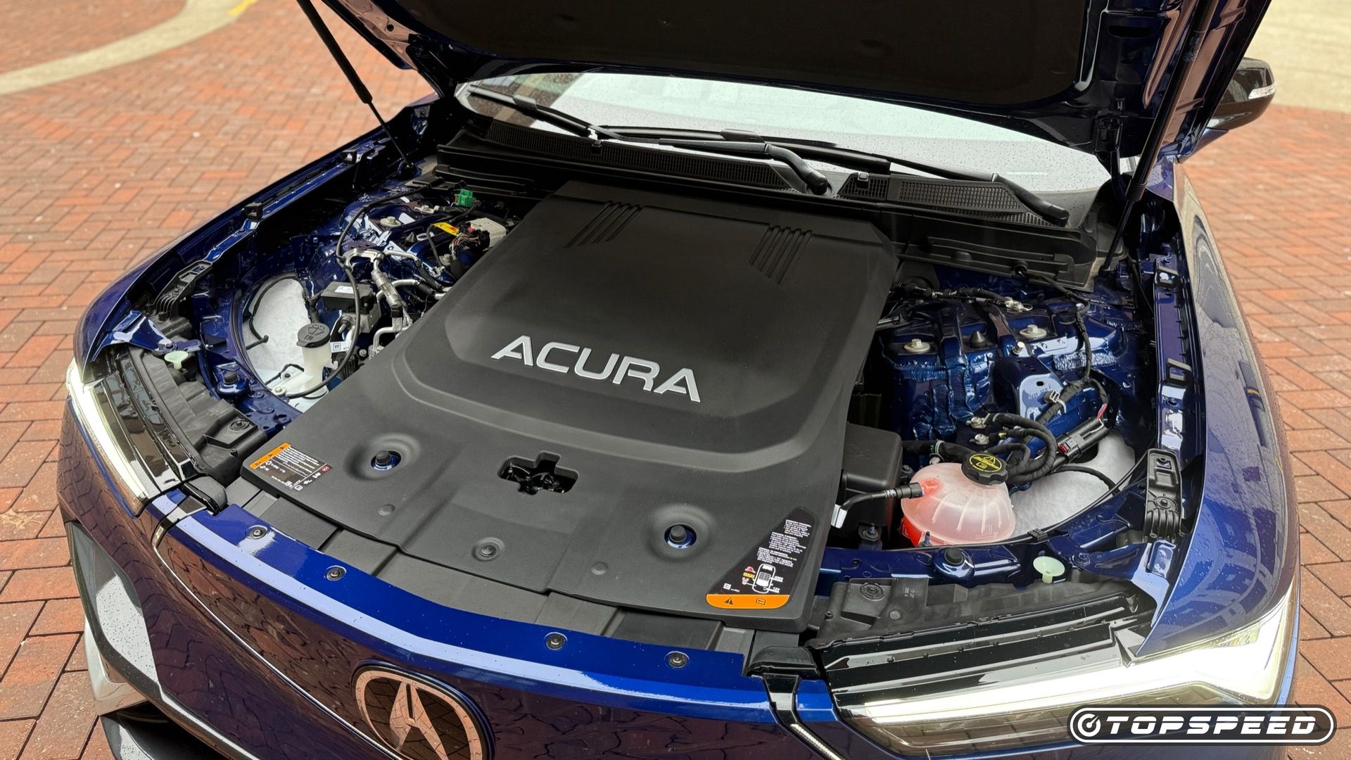 Static close-up photo under the hood of a blue 2025 Acura ZDX A-Spec