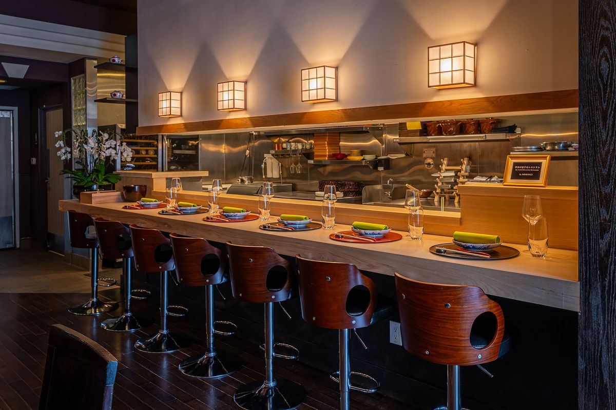 Elegant Japanese tasting menu restaurant counter.