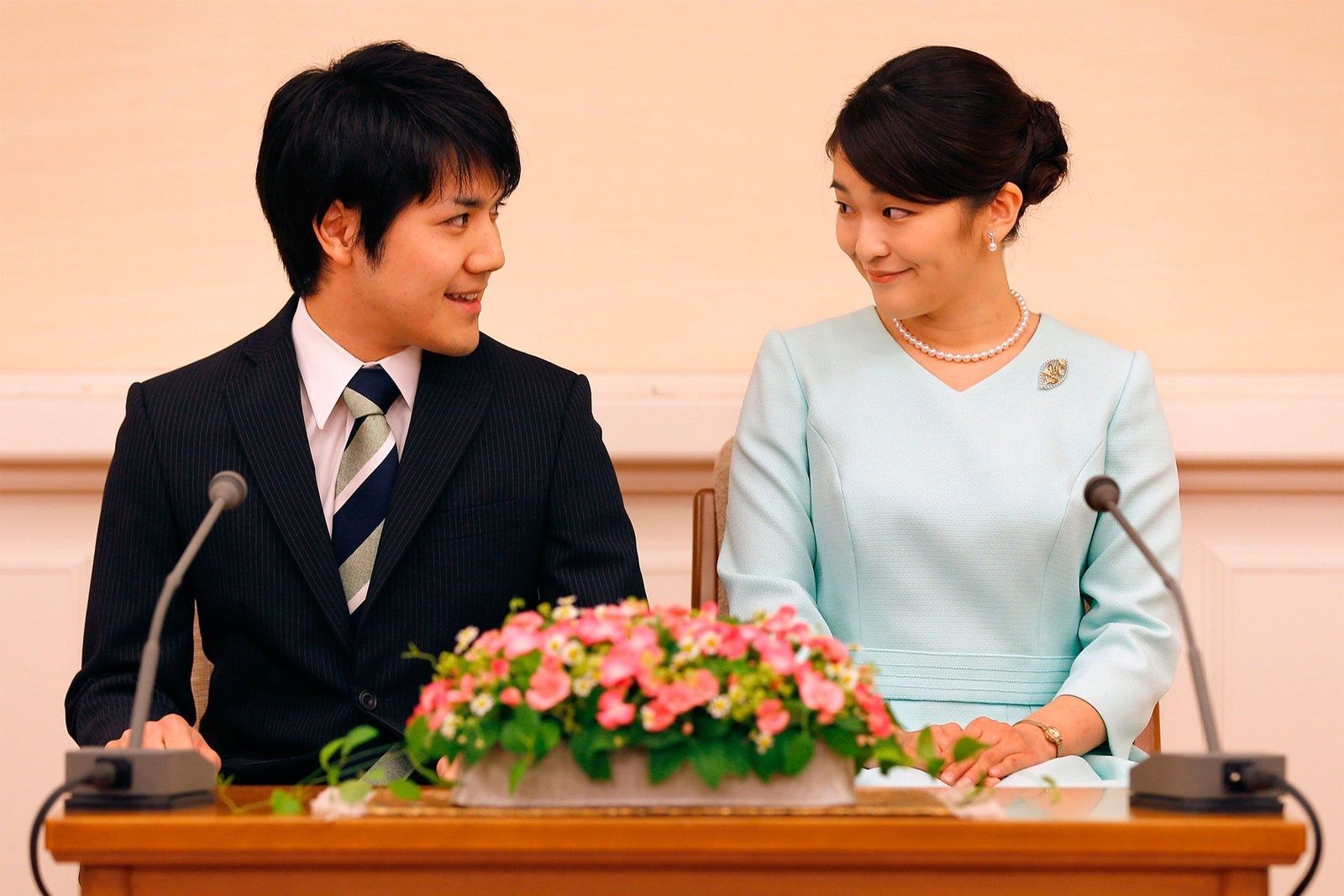 Image may contain Accessories Formal Wear Tie Electrical Device Microphone Adult Person Wedding and Jewelry