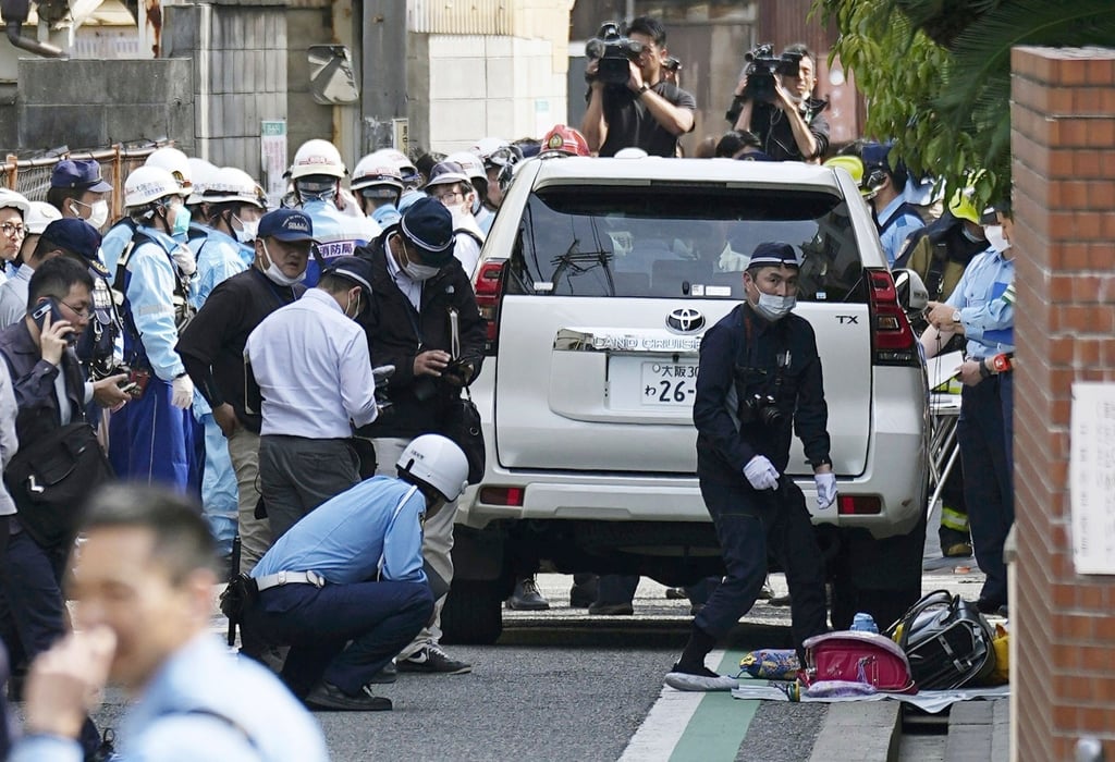 Police officers inspect the vehicle used in the attack in Osaka on Thursday. Photo: Kyodo News via AP Police officers inspect the vehicle used in the attack in Osaka on Thursday. Photo: Kyodo News via AP