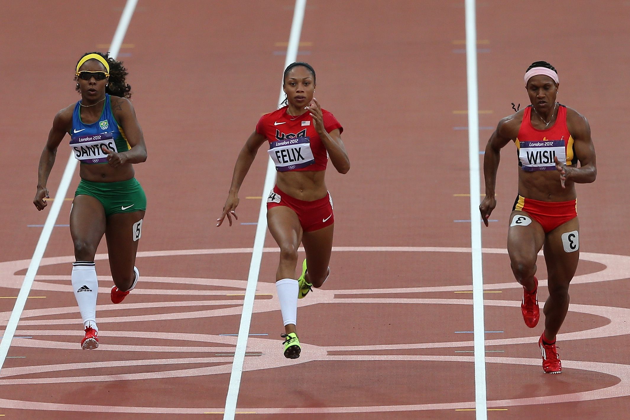 Toea Wisil (right) running alongside Allyson Felix at the London 2012 Olympic Games
