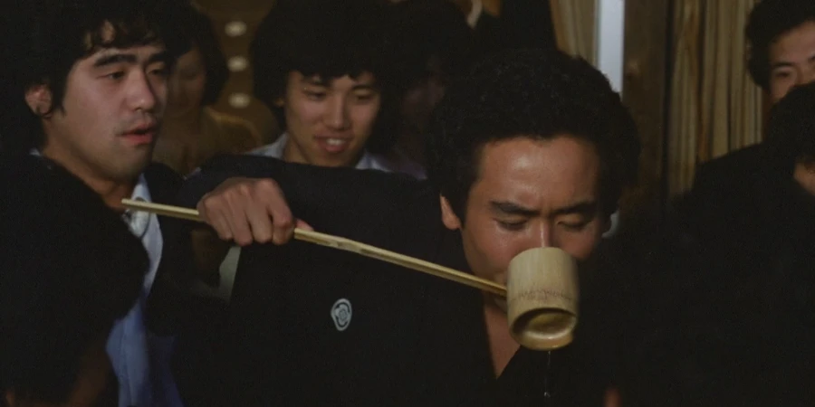 A man drinking at a gathering (from "Distant Thunder")