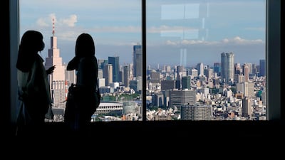 People look out from the viewing deck of the Tokyo Metropolitan Government Building. Emirati and Japanese business leaders, investors and officials are to convene in the city this week. EPA