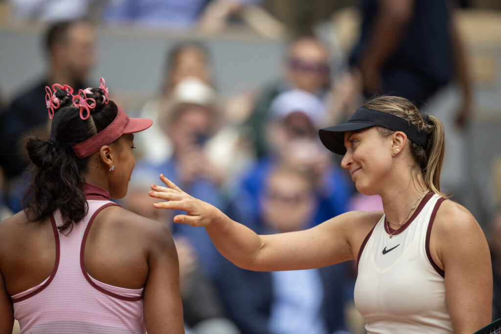 Paula Badosa and Naomi Osaka interact at the net after their match at the 2025 French Open