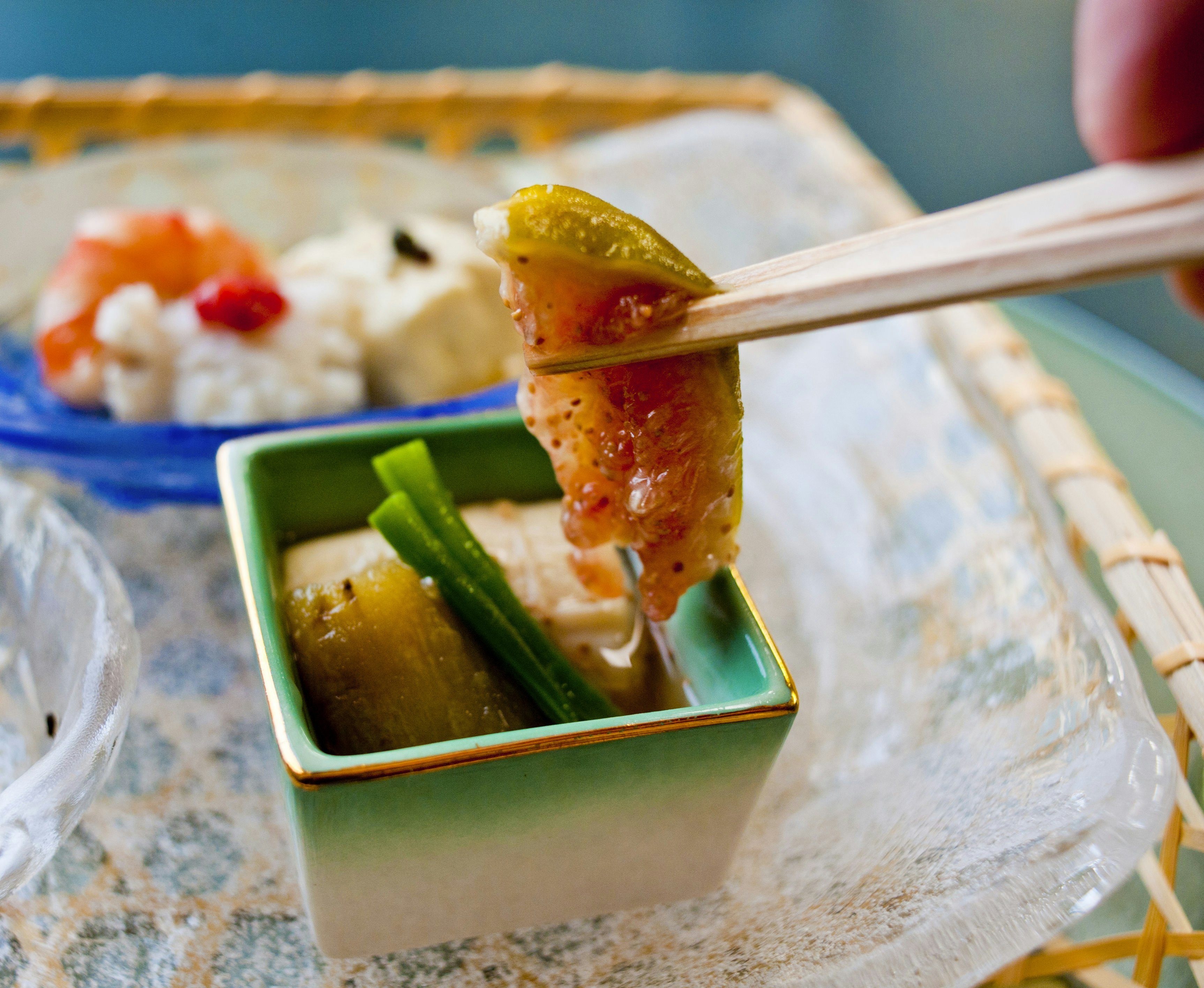 Vegetables prepared and presented beautifully on chopsticks