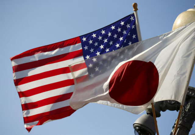 The US and Japan flags fly together outside the White House in Washington April 27, 2015. REUTERS/Kevin Lamarque/File Photo
